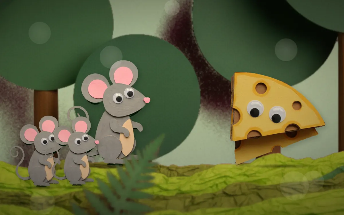 A frame from one of the videos: paper-cut mice next to a wedge of cheese